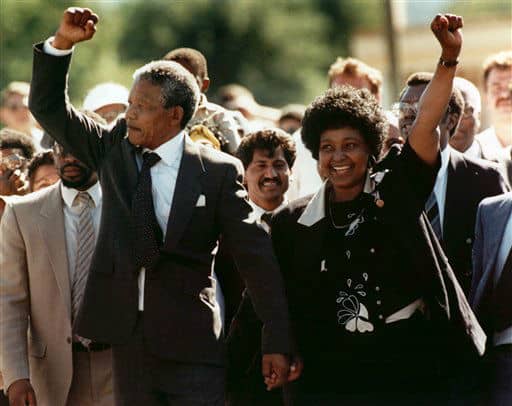 Sunday Feb. 11, 1990 file photo, Nelson Mandela and his then wife Winnie, walk hand in hand upon his release from Victor prison, Cape Town, South Africa.