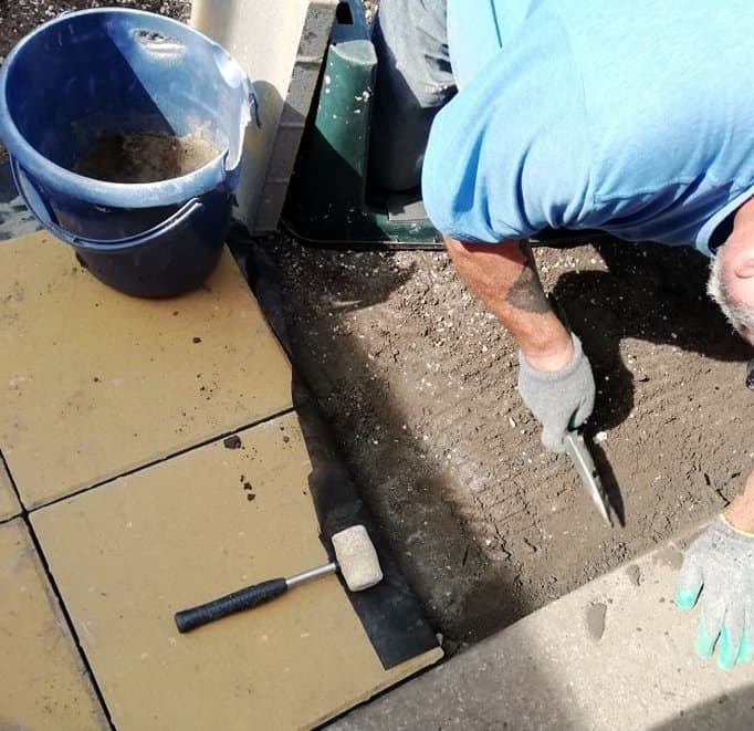 Lay each paving slab down on the ground and put in to place, Continue doing this until you have made the walkway or patio.