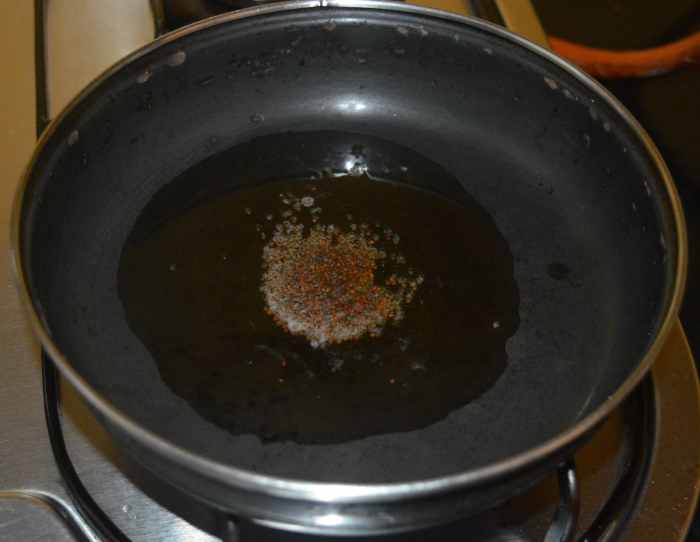 Add mustard seeds. Allow them to crackle.