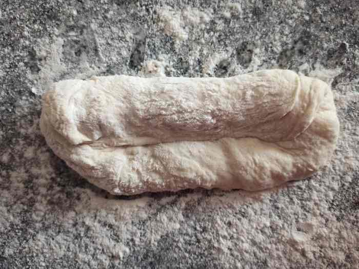 Fold over to halfway and pinch to seal