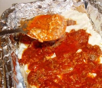 Delicious beef lasagna that is homemade with plentiful amounts of ricotta cheese, mozzarella cheese, beef and tomato sauce