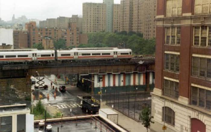 Pubic School 261 which faces Jerome Avenue in the North Bronx is situated the same way as the school in this picture on the right of this picture and in a busy street with lots of taraffic