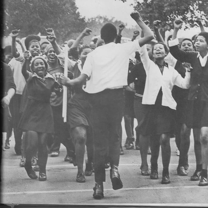 June !6th 1976, Students exuberantly Marching against being Instructed in Afrikaans Language in all their high schools courses; They were also protesting Bantu Education.