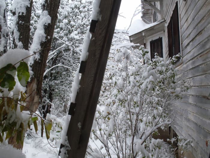 Our house's southern exposure includes a bay window, which helps warm the dining room even on cold days. However, the snow melts slowly amongst the trees, come spring.