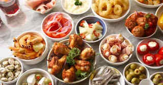 Going out to eat tapas with friends is a good way to reinforce the culture and language learning that you've worked so hard on.