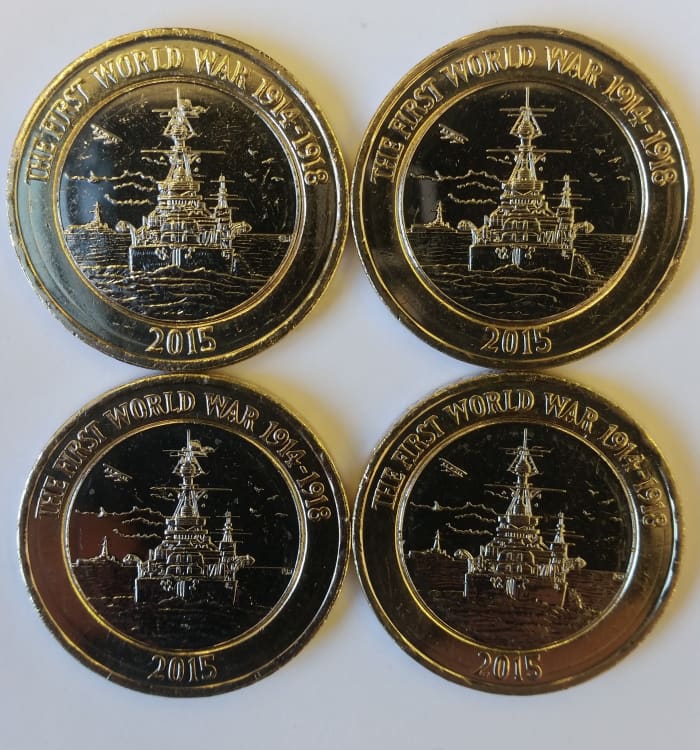 The standard production coin is on the right and the "error" Pennant mast flag is on the left