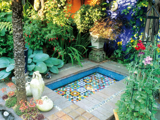 colorful Italian mosiacs inspired by Spanish and Moroccan courtyards make a water feature that is soothing and cheerful