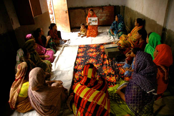 Women in Bangladesh attend a pre-natal education class in which they learn proper nutrition, hygiene, and health tips for their pregnancy.