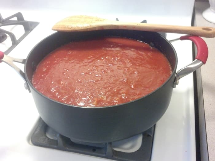 Add the pureed tomatoes and simmer the sauce for 2-3 hours, making sure to stir, taste, and season frequently.