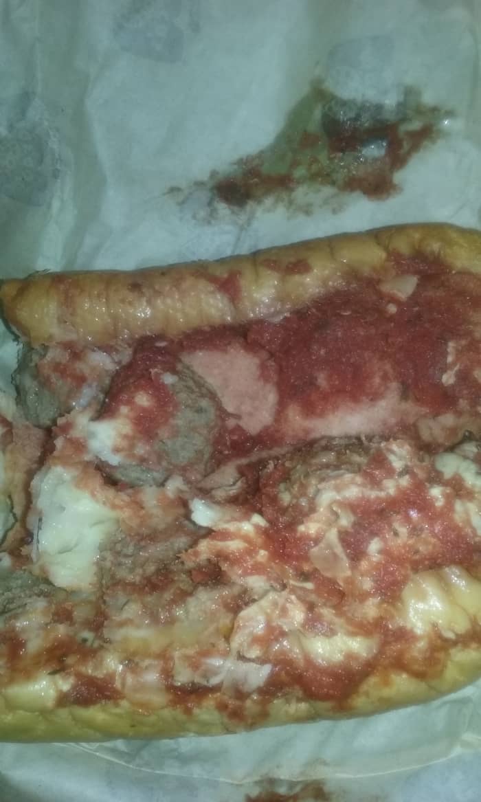 Served at Marco's Pizza Restaurant : Richly flavored meatball sandwich with tomato sauce & lots of cheese.
