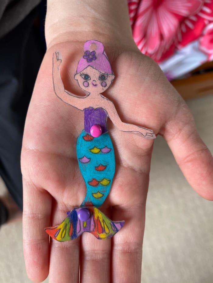 My daughter used the Shrink and Link Jewelry Kit to make this mermaid ornament. She used Faber-Castell pencils to achieve the bold, vibrant colors and make her creation pop!