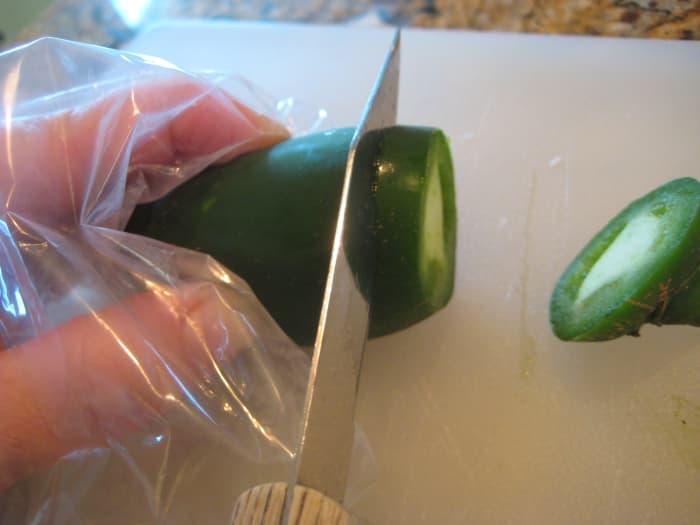 Wear a disposable glove or place a plastic bag over your hand when slicing and chopping jalapenos.