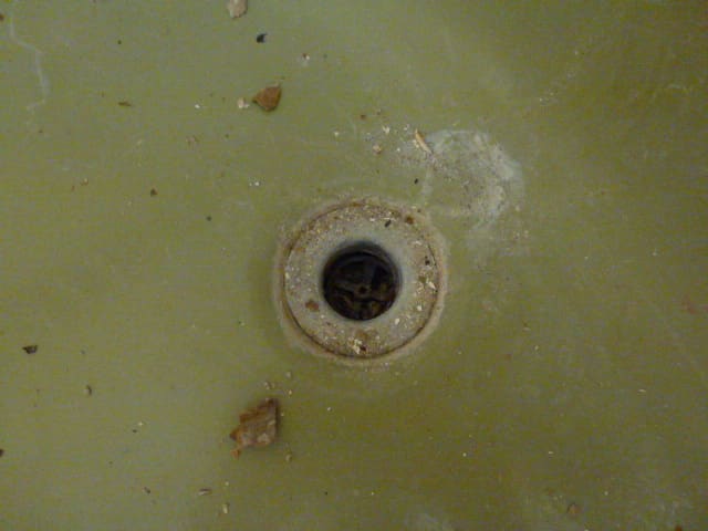 The old drain refused to come out. The small cross pieces in the drain that are used to unscrew the drain simple broke free from the drain instead of turning it.