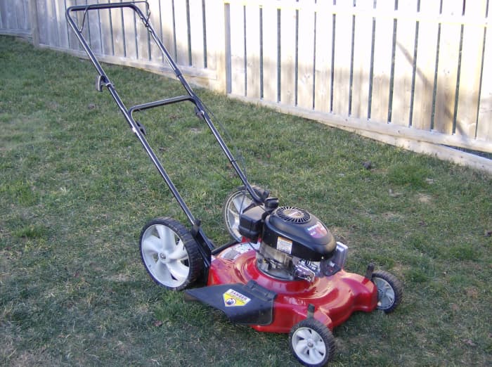 Most mowers have settings that let you raise and lower the mowing blades. By the height of the grass in this photo, you can tell its current setting is low.