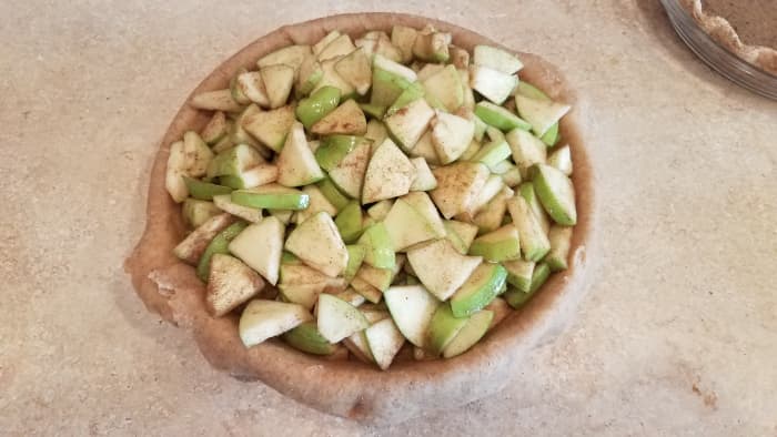 Pour into your pie crust. They should almost overflow your pan. That's okay because they will cook down.