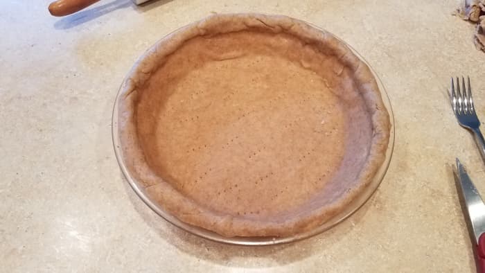 Cut all excess dough from the outside and decorate your edge. I just folded in and rolled for this pie.