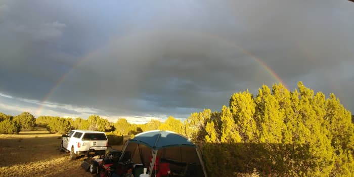 A rainbow forms after an afternoon monsoon season rain