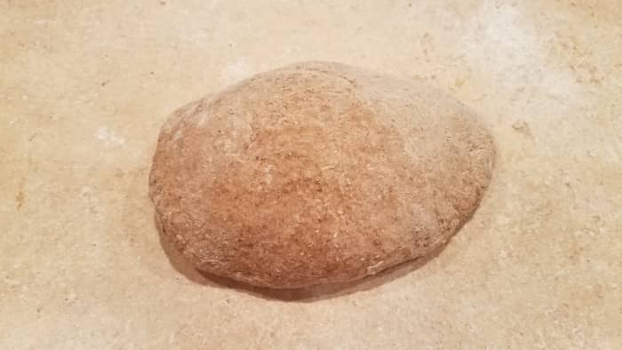 You may have to dump your dough out onto a clean surface and finishing mixing it with your hands. You want a relatively smooth dough.