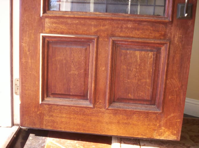 Scratched and weathered with a faded, flaking finish, our home's front door was in shoddy shape.