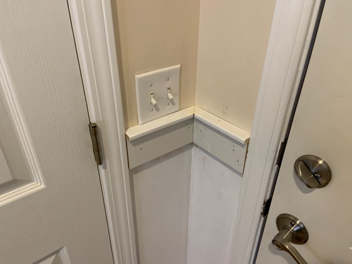 Horizontal board and top rail board install in corner. Note the 45° cuts required for the top rail board. These cuts are easily done with a miter box.