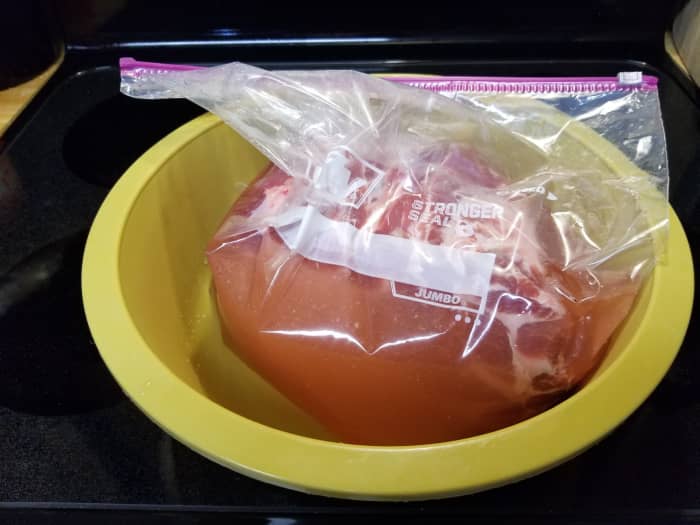 Brining meat is crucial for flavor and juiciness and the bag in a bowl method is crucial for keeping a clean refrigerator in case of messy spills.