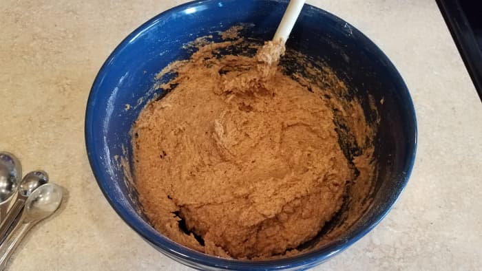 Honestly it doesn't matter what order you mix everything in, or when you stir it. You can even mix after each ingredient if you wish. Just get it all in there.