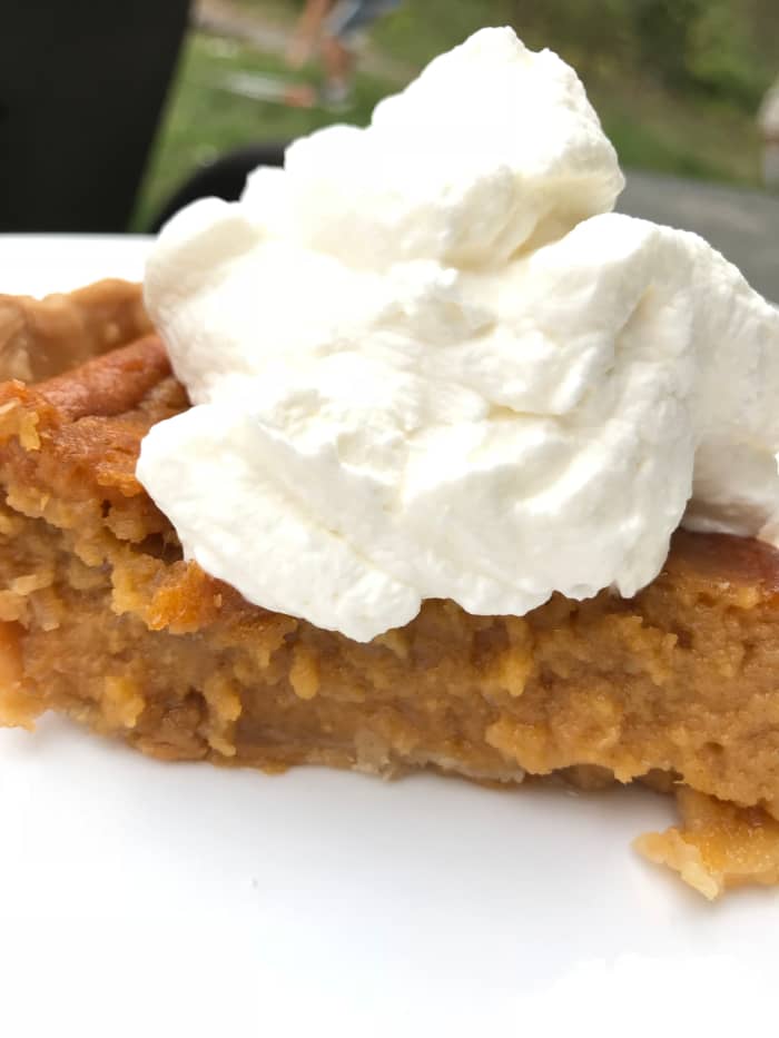 Cool the sweet potato pie completely before serving. Fresh whipped cream is the perfect pairing for the rich, silky pie.