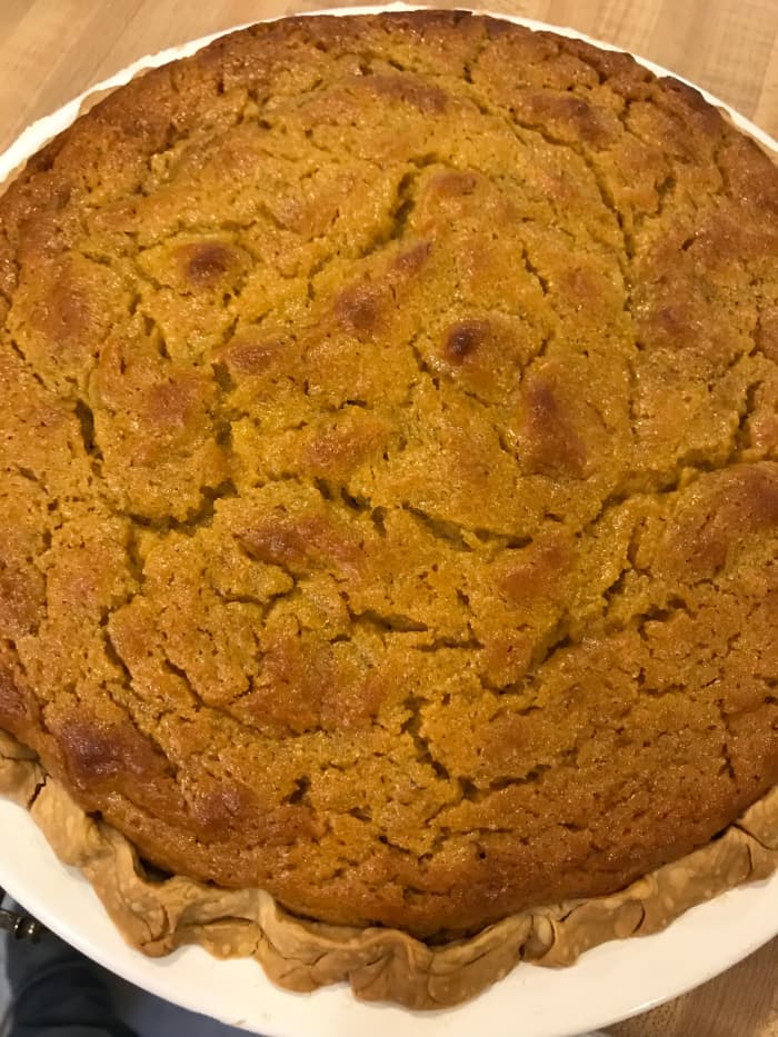 Freshly baked sweet potato pie should be pulled from the oven while it still has the barest wiggle in the center. It will finish with carryover cooking, and the center will be silky smooth.