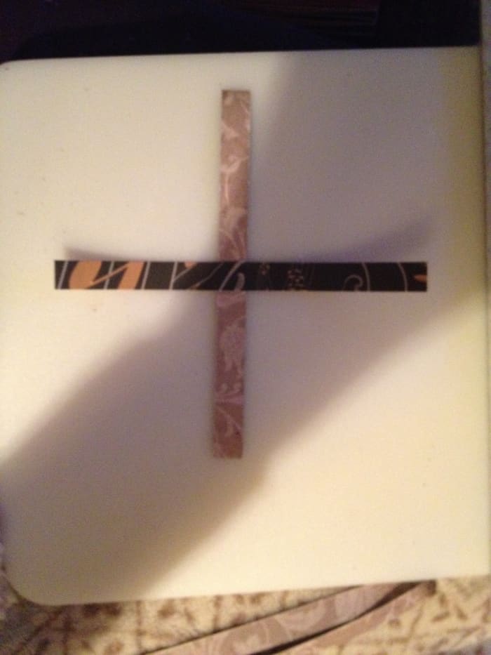 Put two strips together (I like to place them with opposite sides up) to create an x. Put a dot of Elmer's glue at 3" on one and glue them together.