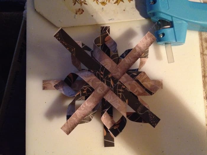 Place one side over the other with the center strips of each side matched up with the loops of the other side.