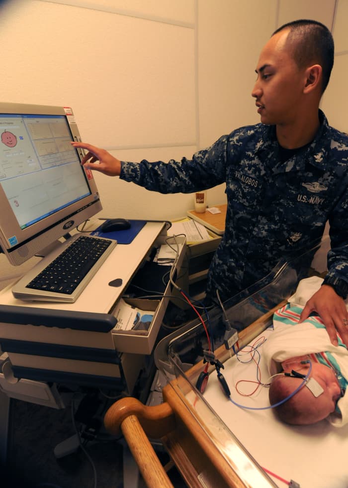 A baby receives a newborn hearing screening test.