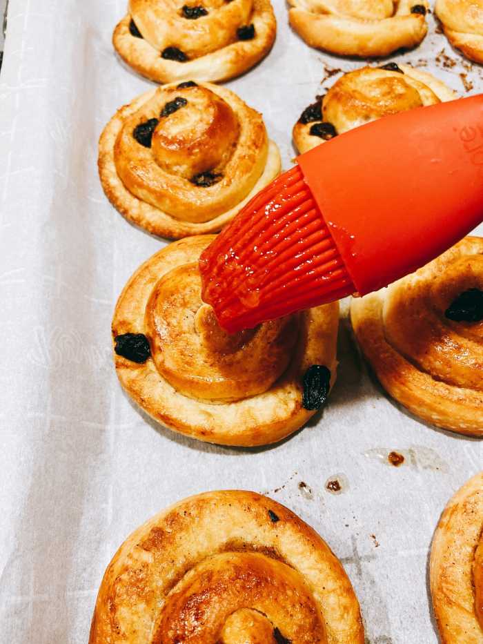 Brush each Danish with orange marmalade. Let the marmalade sit for a few minutes. 