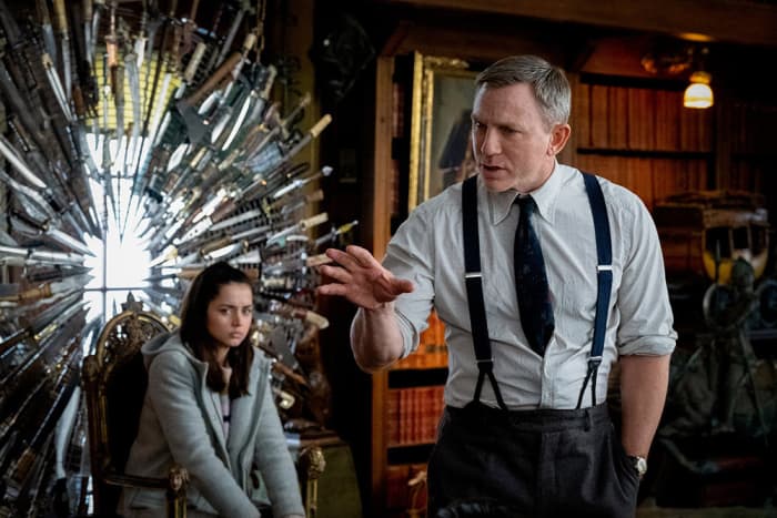 The film pitches a unique battle of wits between the charismatic investigator played by Craig (right) and the guilt-plagued nurse played by de Armas (seated).