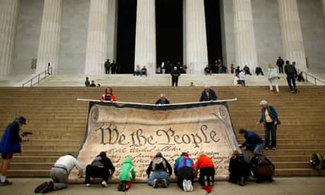 Protesters against the supreme court decision on corporate political spending roll up a giant version of the US constitution, the 'most powerful statement of democratic principle … ever written'.