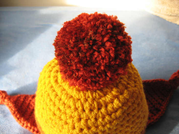 A nice dense pom-pon is my preference, but if you like a soft loose pom-pon, that works too. The perspective in this picture makes the pom-pon look huge, but it is only about 3 inches in diameter.
