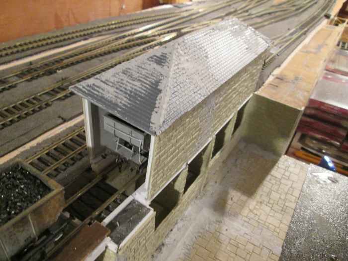 View of the lime shed to get you up-to-date. Ridge tiles, guttering and downpipes to add before painting. Wills' (Peco) Slate Roofing sheets were used for the roof and an amount of filler to disguise the gaps. Empty hopper in the lime she