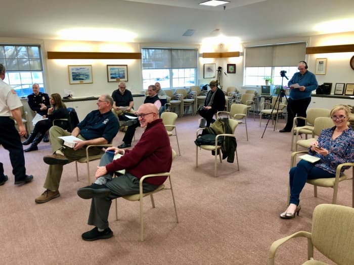 The woman in the above picture to the right did not choose to sit up front, but positioned herself behind the man. This indicates she sees herself as less important than others, preferring to instead stay in the background.