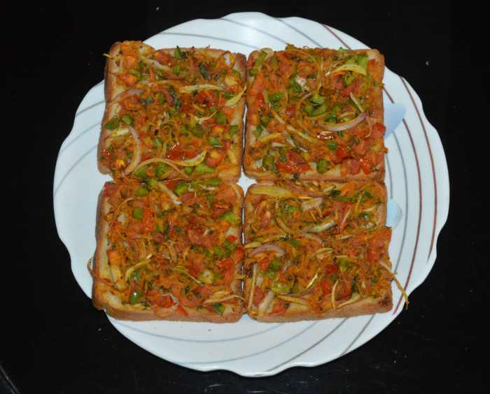 Step four: Once done, take the grill stand out. Your favorite bakery-style masala bread toast is ready! Enjoy eating this yummy toast as an evening snack or as light dinner.