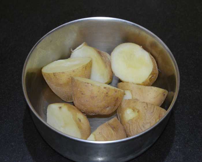 Step two: Make the stuffing. Boil, peel, and mash the potatoes.