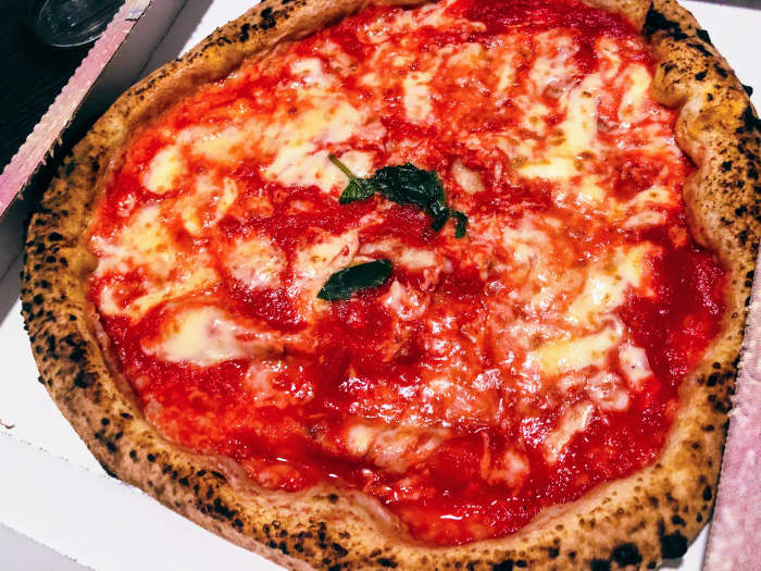 A traditional pizza you can eat in Italy: even by looking at it in a picture, you can notice this is not exactly the kind of pizza you would eat in a standard chain of pizzerias in the USA or other countries.
