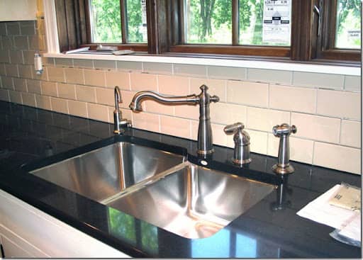 Beautiful food preparation sink and faucet with filtered water mounted under the kitchen counter top