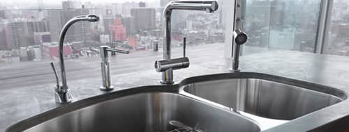 Beautiful food preparation sink and faucet with filtered water mounted under the kitchen counter top