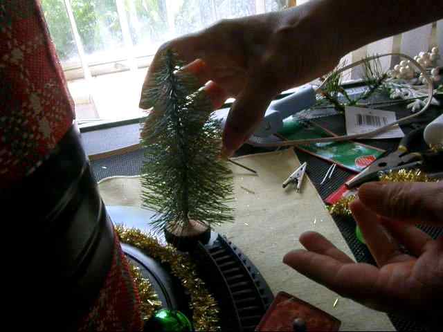 To give the impression that the train was abandoned, I placed a small tree at the end of the rack. This also helped to camouflage the broken end of railroad track.