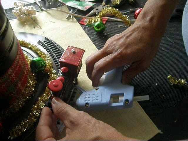 I glued on a train that was broken. This was not part of my original plan, but it worked out beautifully.