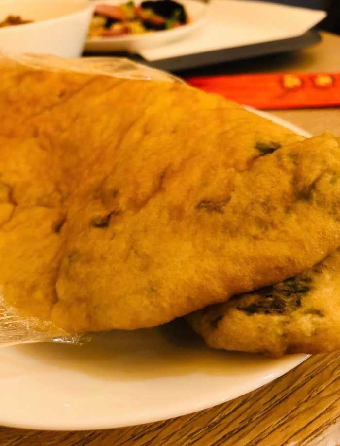 A Chinese Cong You Bing wrapped. You can eat it like an Italian piadina or a 'pizza a portafoglio', a Neapolitan pizza recipe meant to be folded and eaten while walking.