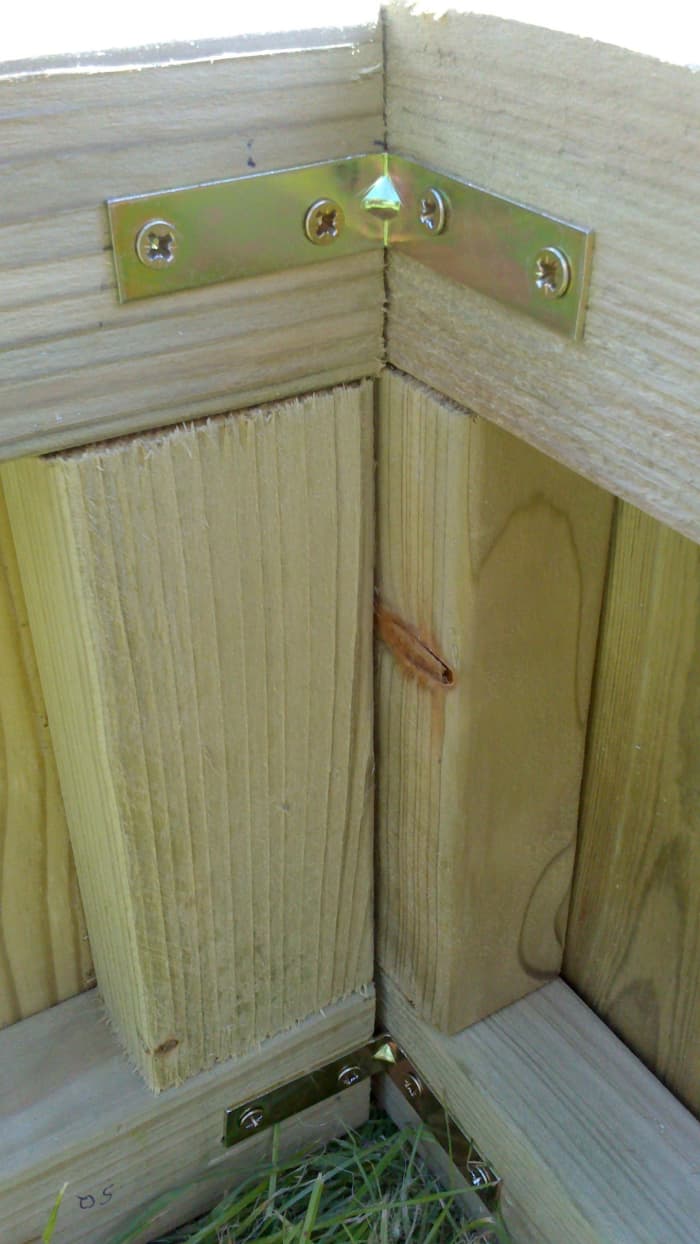This is one of the four corners we had to secure first by using brass screws and brass brackets