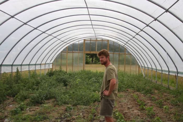 This is a large example of a hoop house. For the home gardener smaller versions work well and can be built from lots of easy to find cheap materials.
