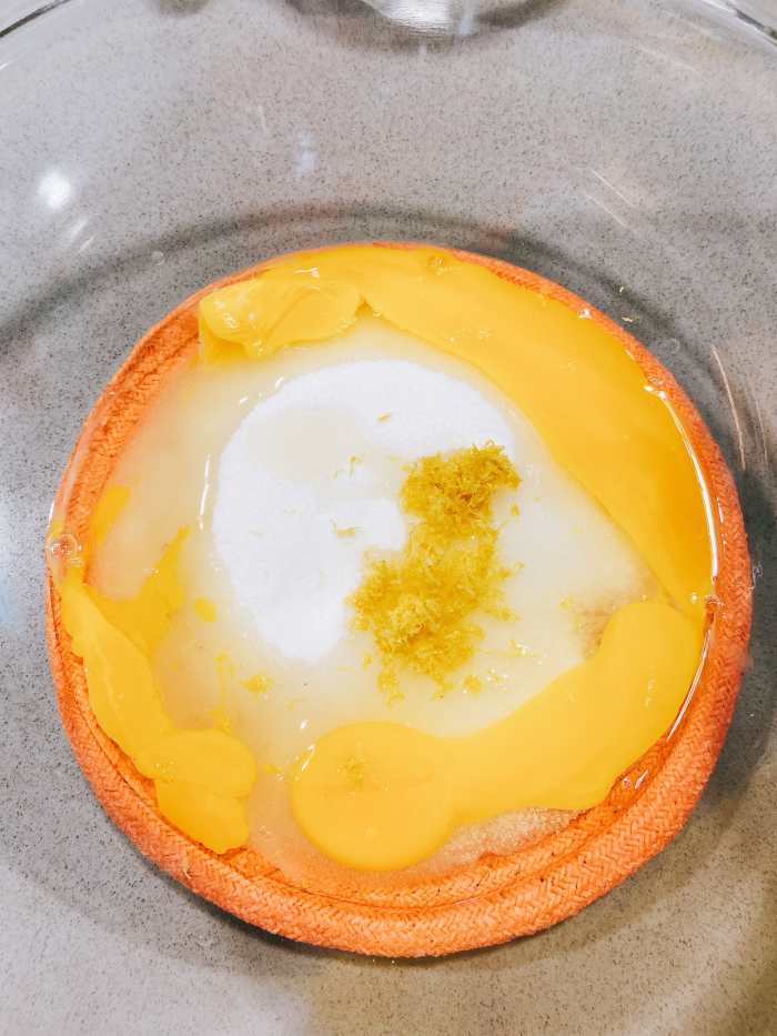 In a large bowl, combine the sugar and eggs. 