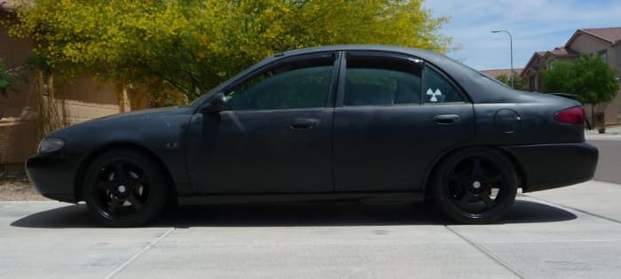 Bryan Patrick Miller’s matte black Ford Escort, possibly similar to the dark four-door vehicle seen in surveillance footage within minutes of Adrienne Salinas’s disappearance.