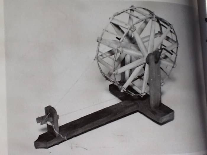 A primitive wheel from Burma. Only one step removed from a hand spindle. The Indian charkha probably resembled this in design and function.